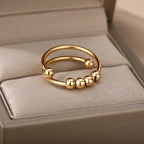 Anti-Stress Ring Band with Spinning Pearls gold