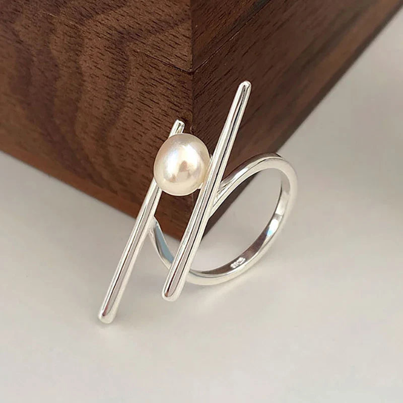 Stylish Ring with White Pearl in Zircon