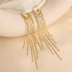 Boucles d'oreilles à pompons sublimant le visage