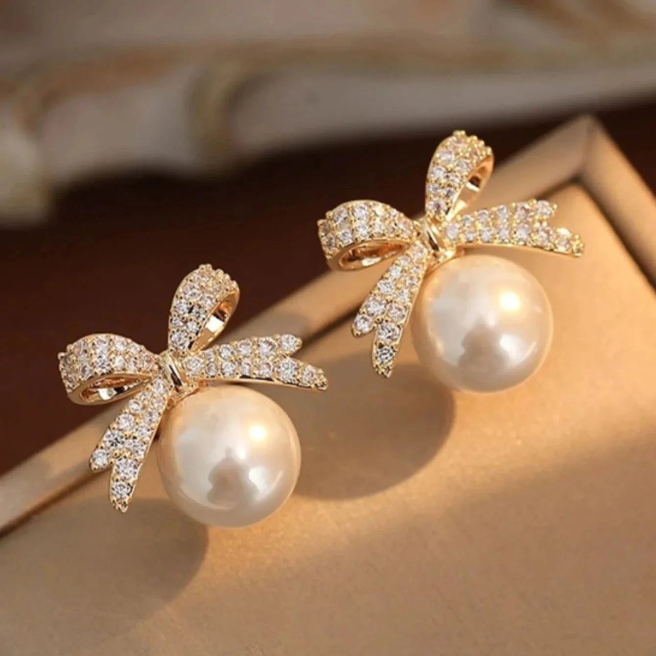 Elegant Stud Earrings with Pearl and Rhinestone Butterfly Bow
