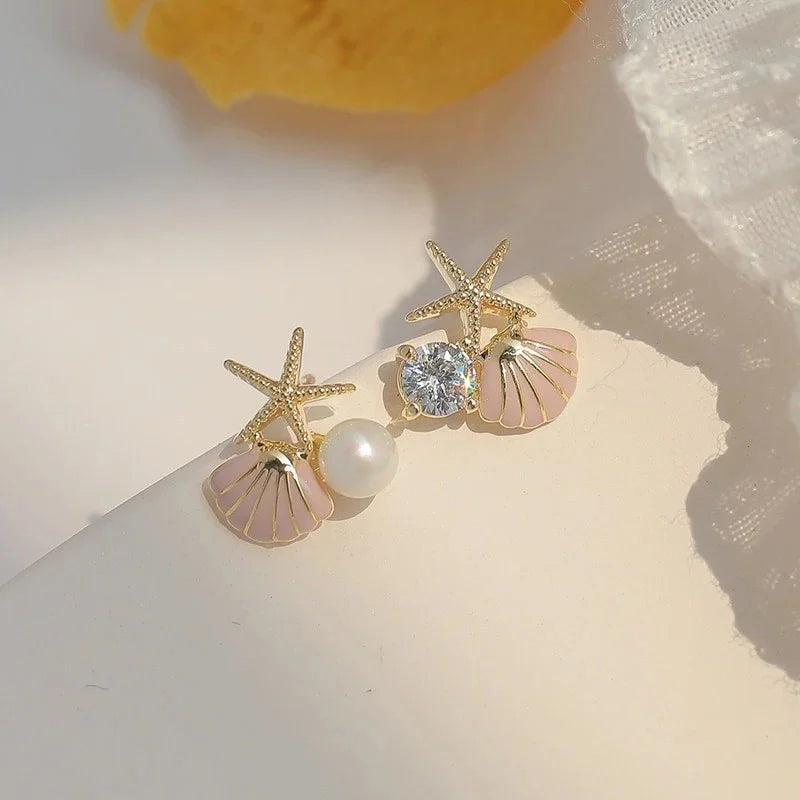 Boucles d'oreilles coquillage asymétriques rose