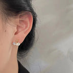 Boucles d'oreilles coquillage asymétriques blanc