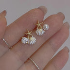 Boucles d'oreilles coquillage asymétriques blanc