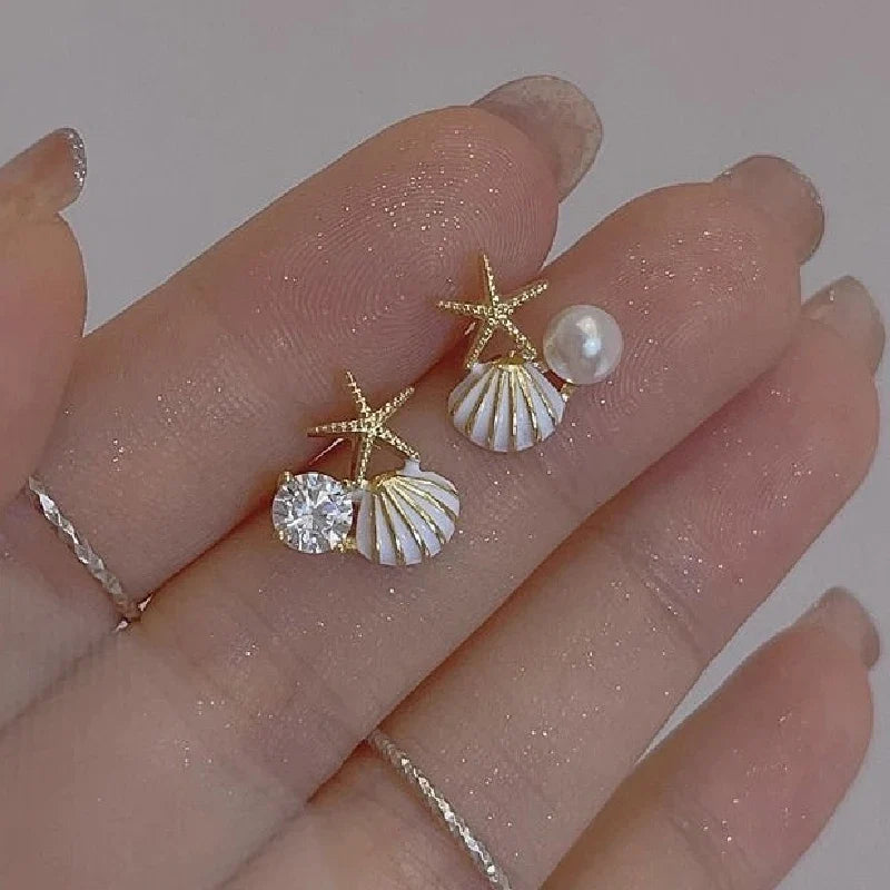 Boucles d'oreilles coquillage asymétriques blanc