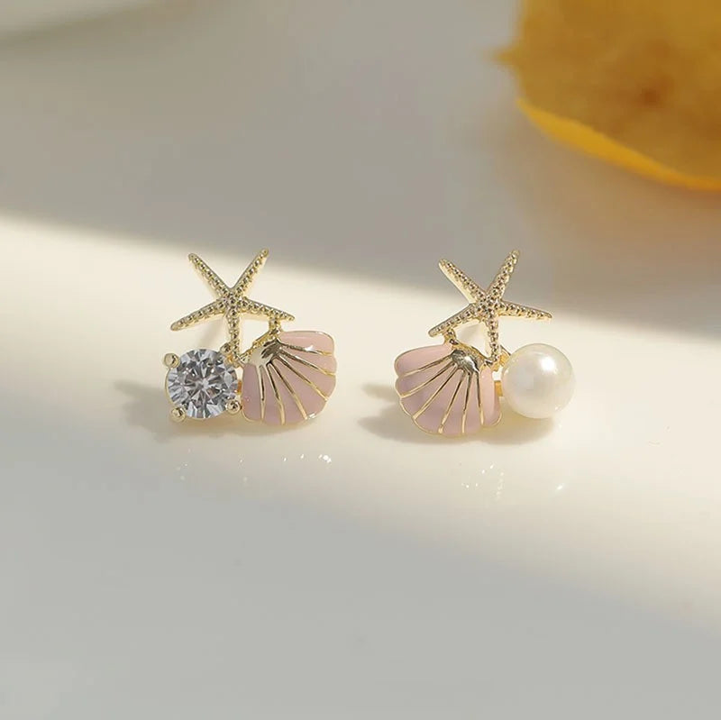 Boucles d'oreilles coquillage asymétriques rose