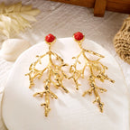 Boucles d'oreilles corail dorées