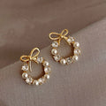 Hoop Earrings with Pearls and Butterfly Knot