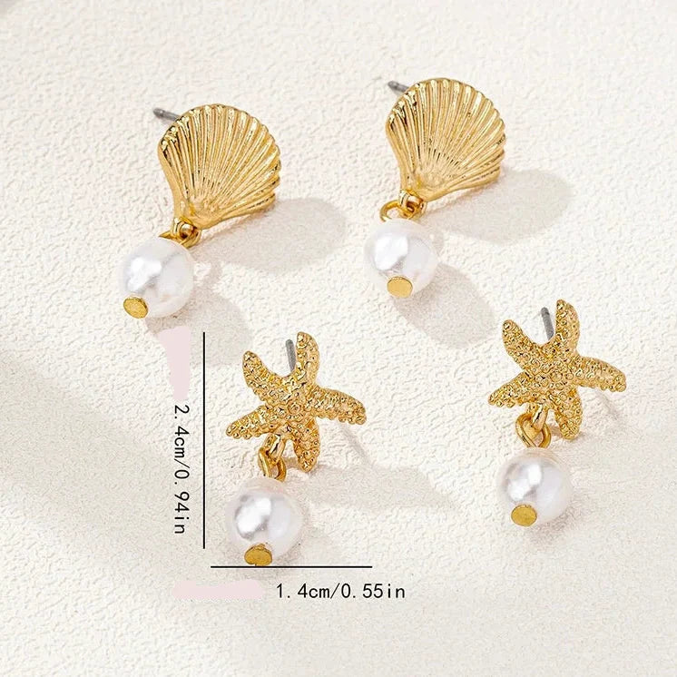 Boucles d'oreilles dorées coquillage et perle