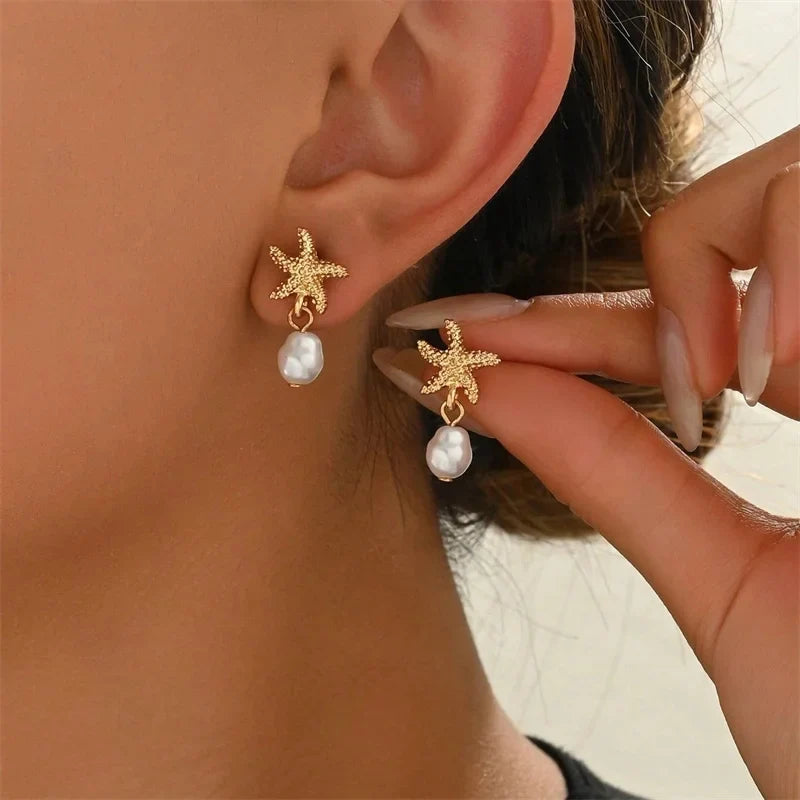Boucles d'oreilles dorées coquillage étoile de mer et perle