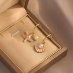 Boucles d'oreilles émaillées coquillage et perle rose