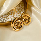 Boucles d'oreilles en forme de spirale bombée or
