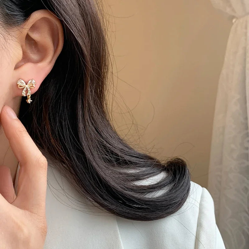 Boucles d'oreilles noeud papillon femme or