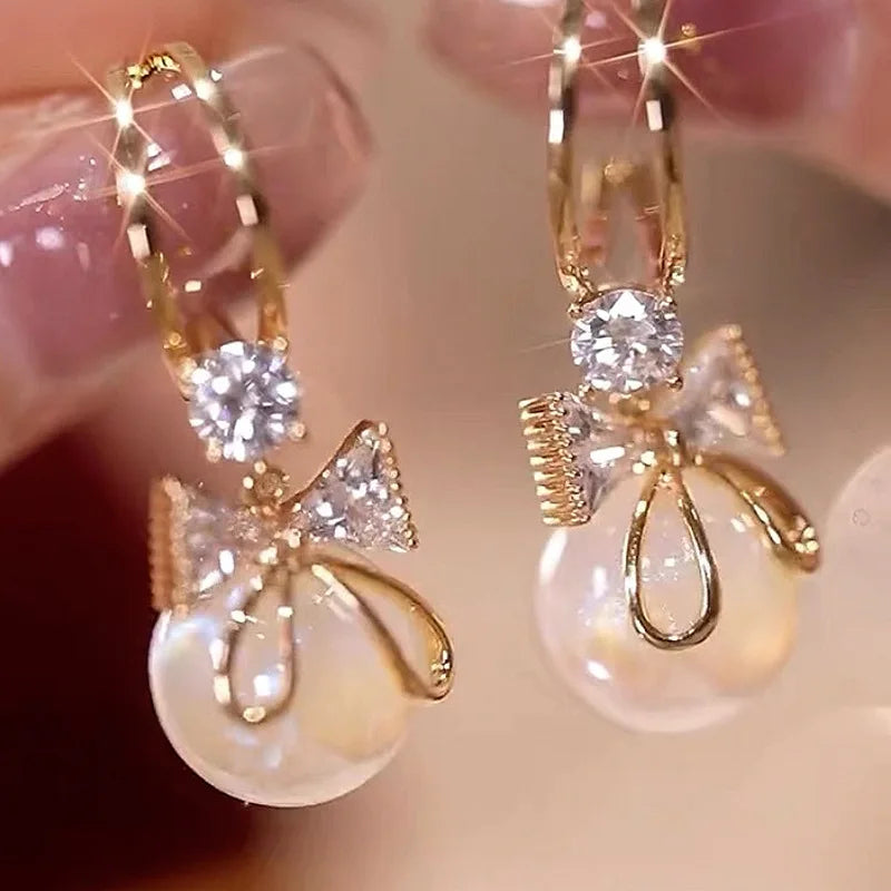 Dangling Earrings with Butterfly Knot and Pearl