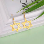 Boucles d'oreilles pendantes hexagonales avec le symbole juif de l'étoile de David or