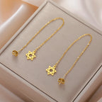 Boucles d'oreilles pendantes longues avec l'étoile de David symbole juif or