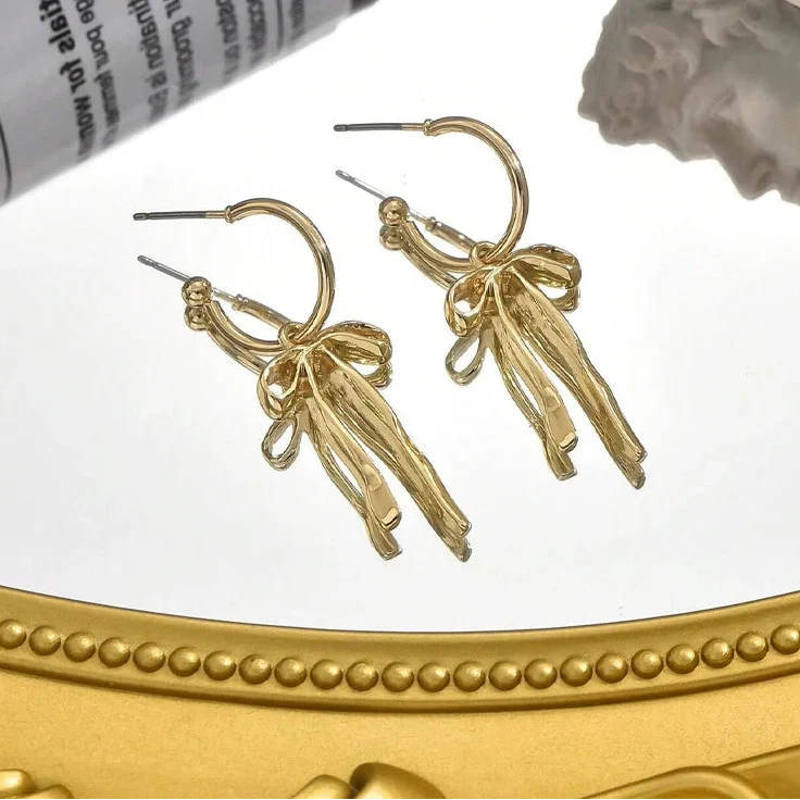 Boucles d'oreilles pendantes noeud papillon