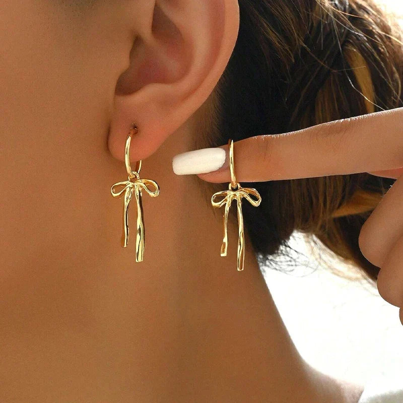 Boucles d'oreilles pendantes noeud papillon