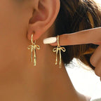 Boucles d'oreilles pendantes noeud papillon