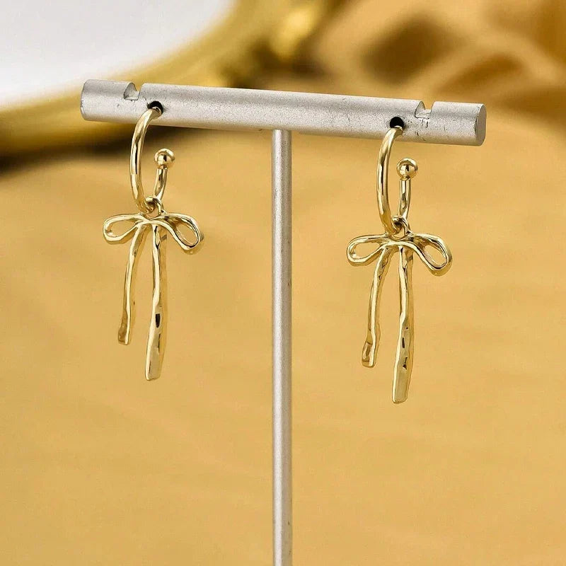 Boucles d'oreilles pendantes noeud papillon