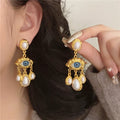 Blue Eye and Gold Beads Dangling Earrings