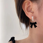 Dangling Earrings with Pearls and Black Bows