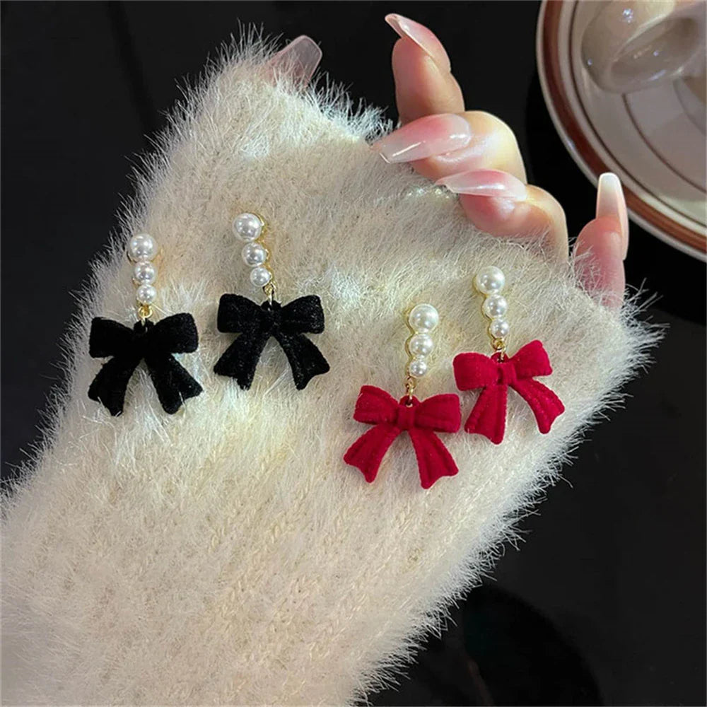 Dangling Earrings with Pearls and Black Bows