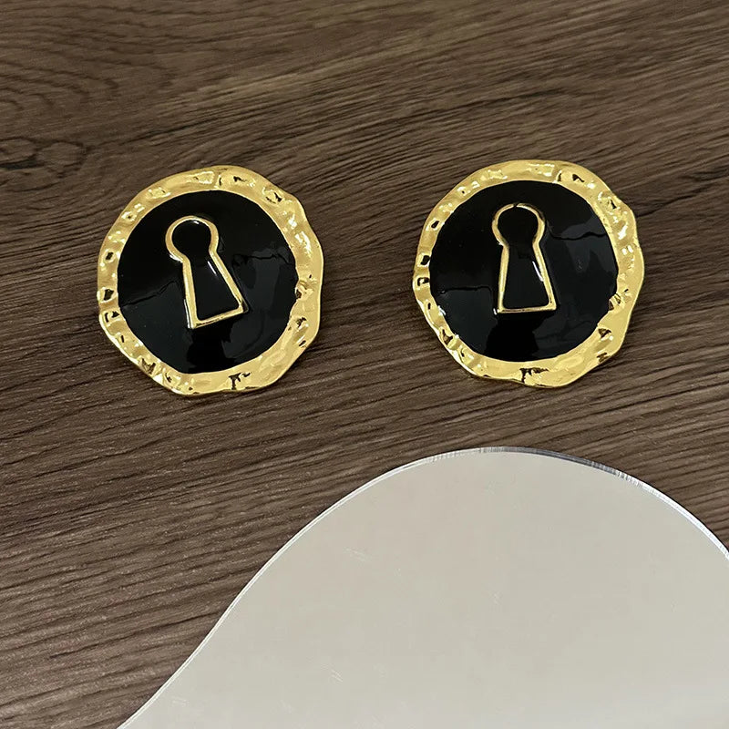 Boucles d'oreilles rondes clef noir