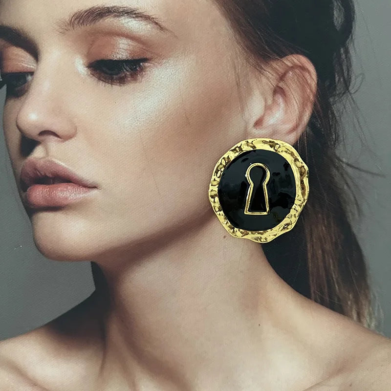 Boucles d'oreilles rondes clef noir