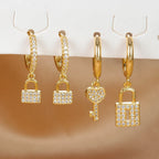 Boucles d'oreilles créoles clef et cadenas avec strass clef et cadenas or