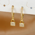Boucles d'oreilles créoles clef et cadenas avec strass or