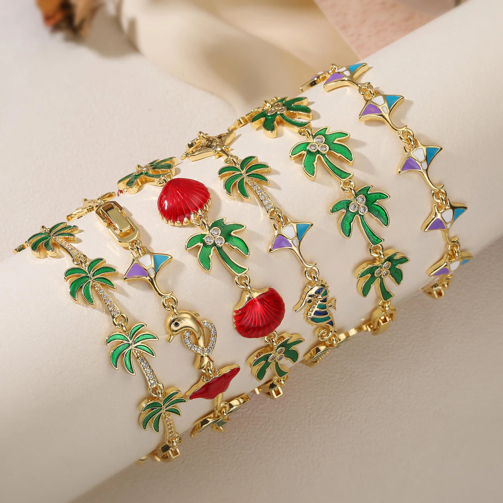 Bracelet avec breloques de palmiers en émail vert