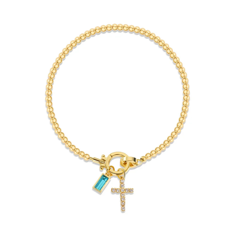 Bracelet avec croix et pierre de naissance