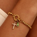 Bracelet avec croix et pierre de naissance décembre