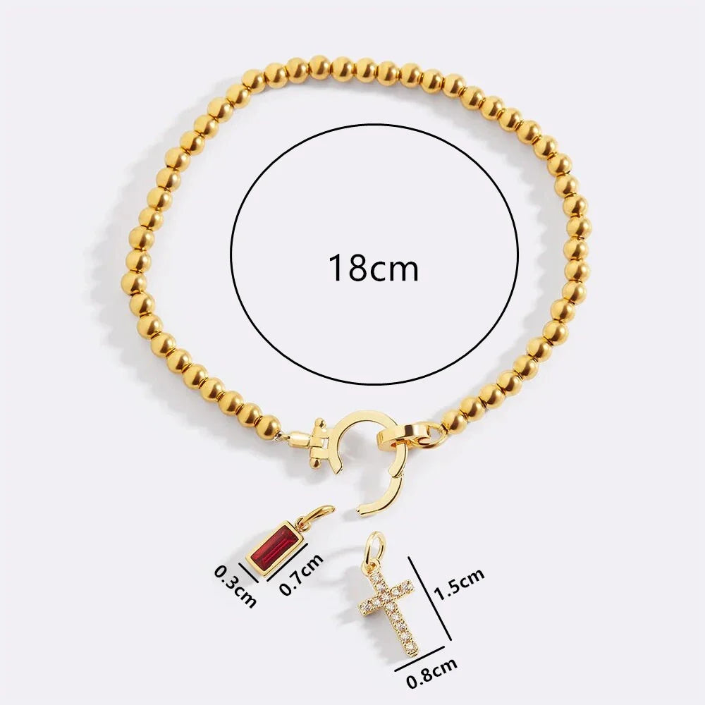 Bracelet avec croix et pierre de naissance