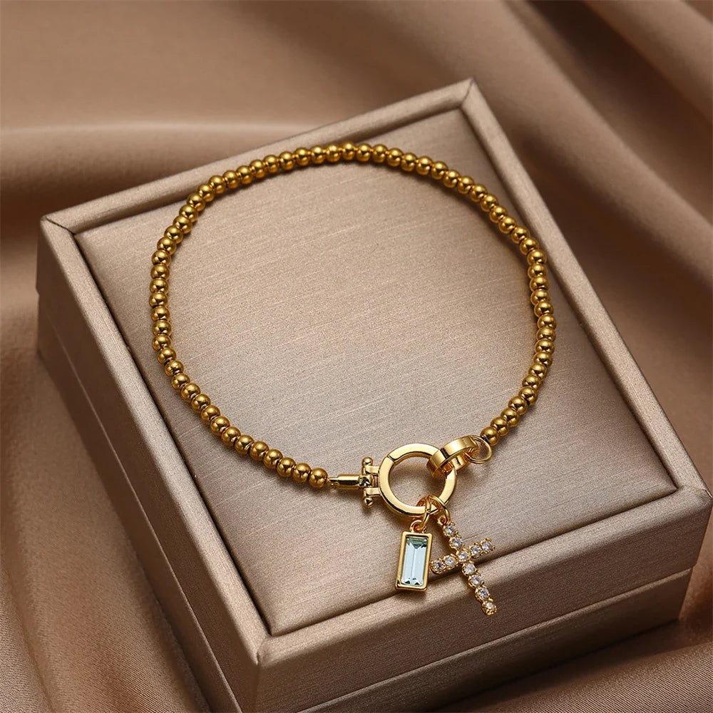 Bracelet avec croix et pierre de naissance