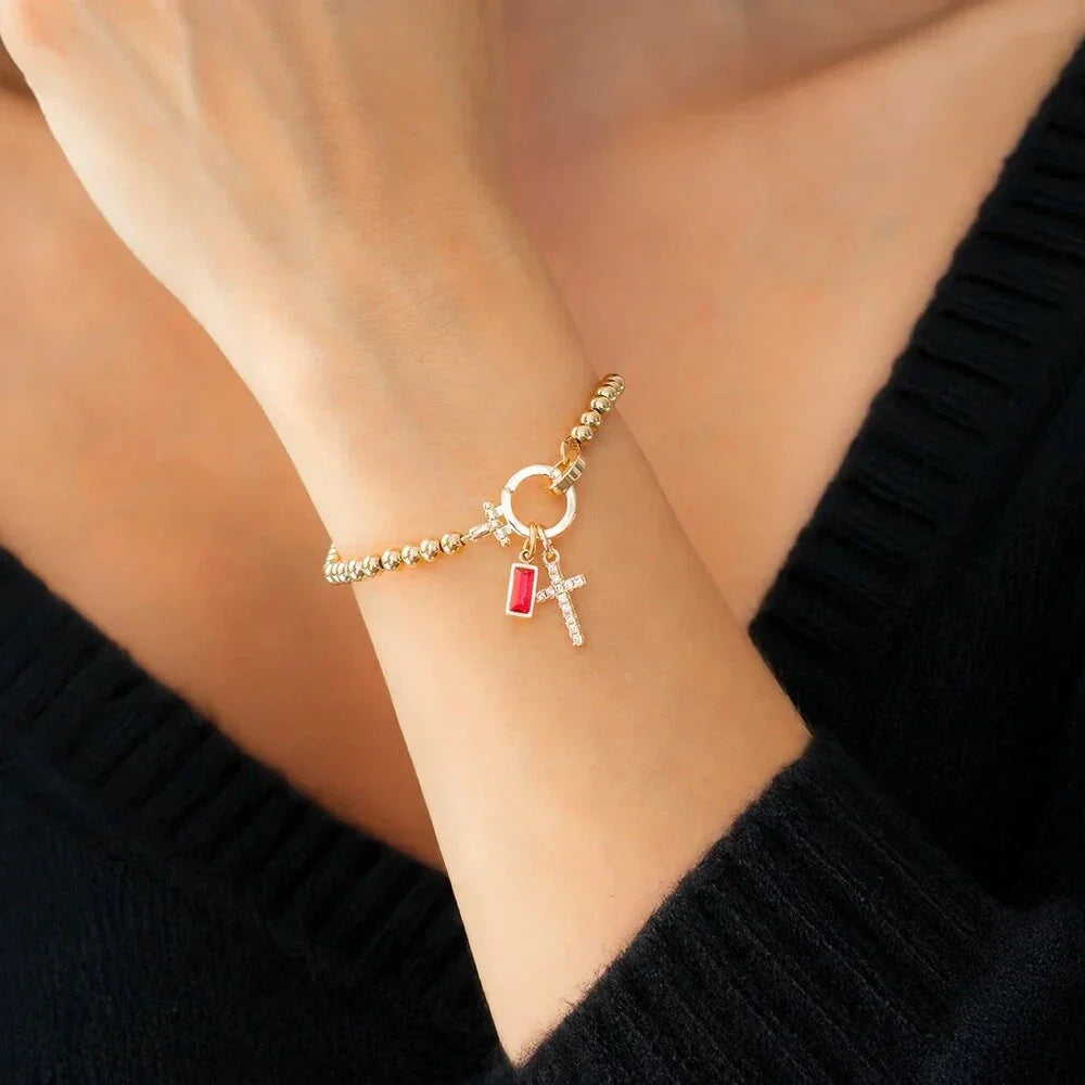 Bracelet avec croix et pierre de naissance