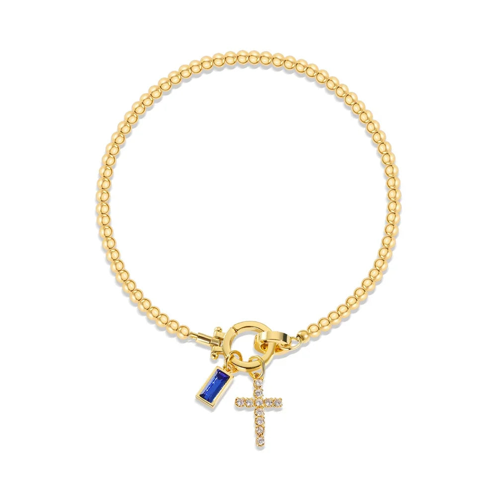Bracelet avec croix et pierre de naissance