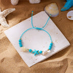 Bracelet cordon avec coquillage et étoile de mer bleu étoile