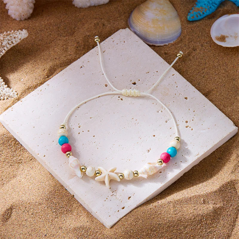 Bracelet cordon avec coquillage et étoile de mer blanc étoile