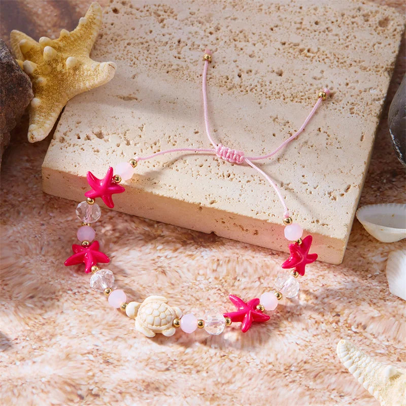 Bracelet cordon avec coquillage et étoile de mer rouge tortue