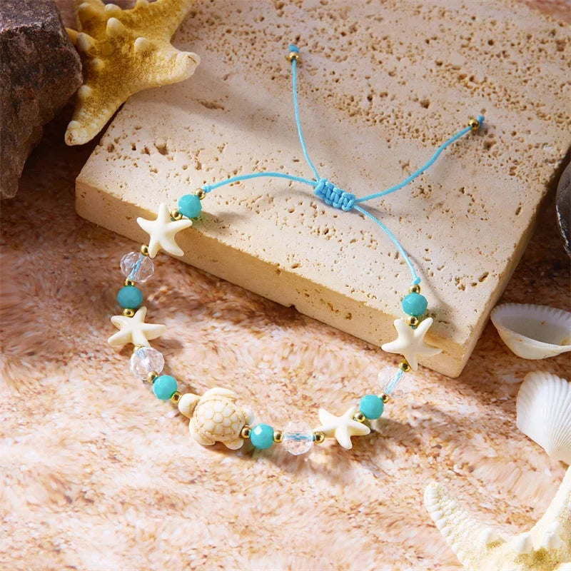 Bracelet cordon avec coquillage et étoile de mer bleu tortue