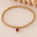 Bracelet doré avec pierre de naissance pour femme