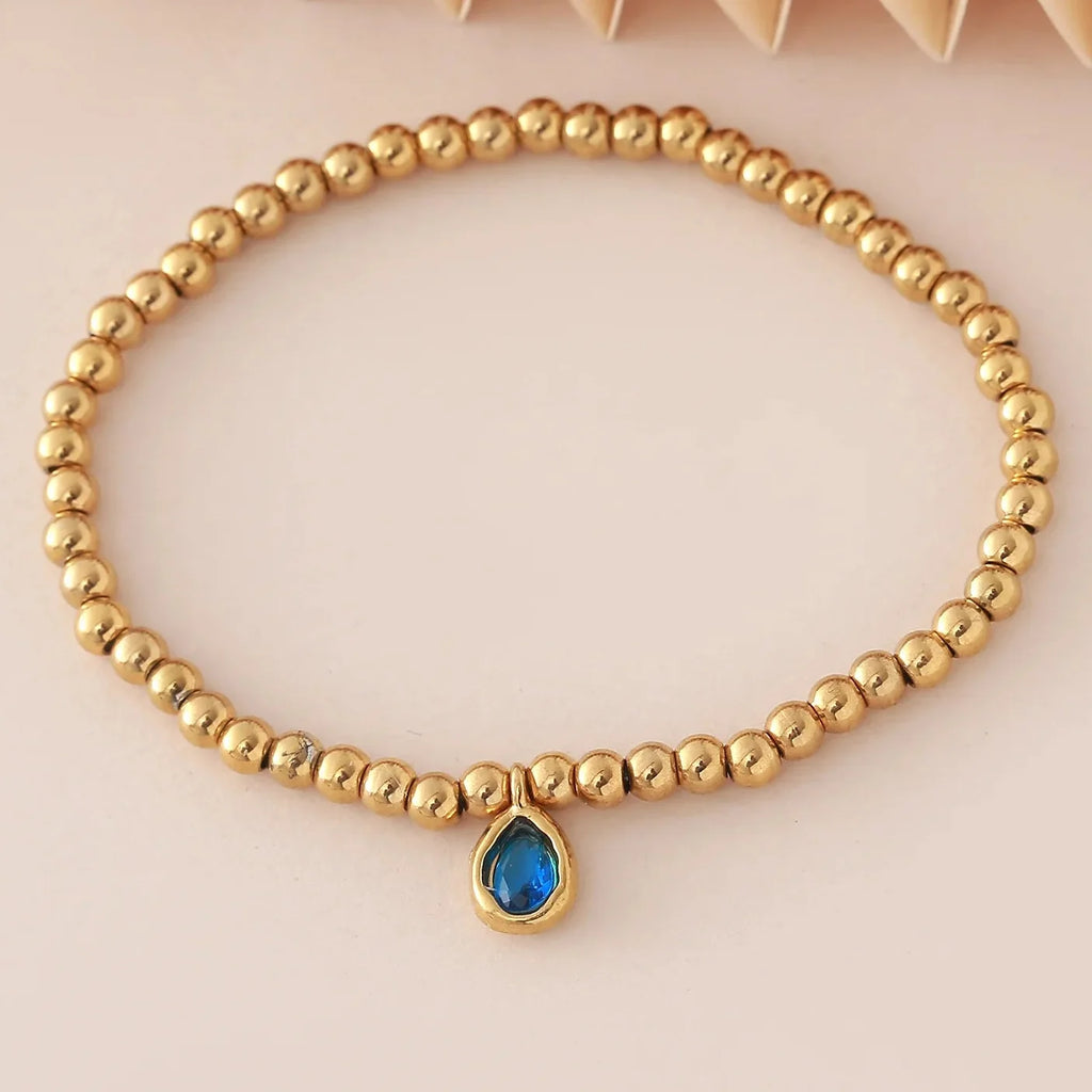 Bracelet doré avec pierre de naissance pour femme