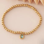 Bracelet doré avec pierre de naissance pour femme