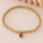 Bracelet doré avec pierre de naissance pour femme
