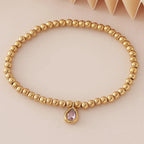 Bracelet doré avec pierre de naissance pour femme