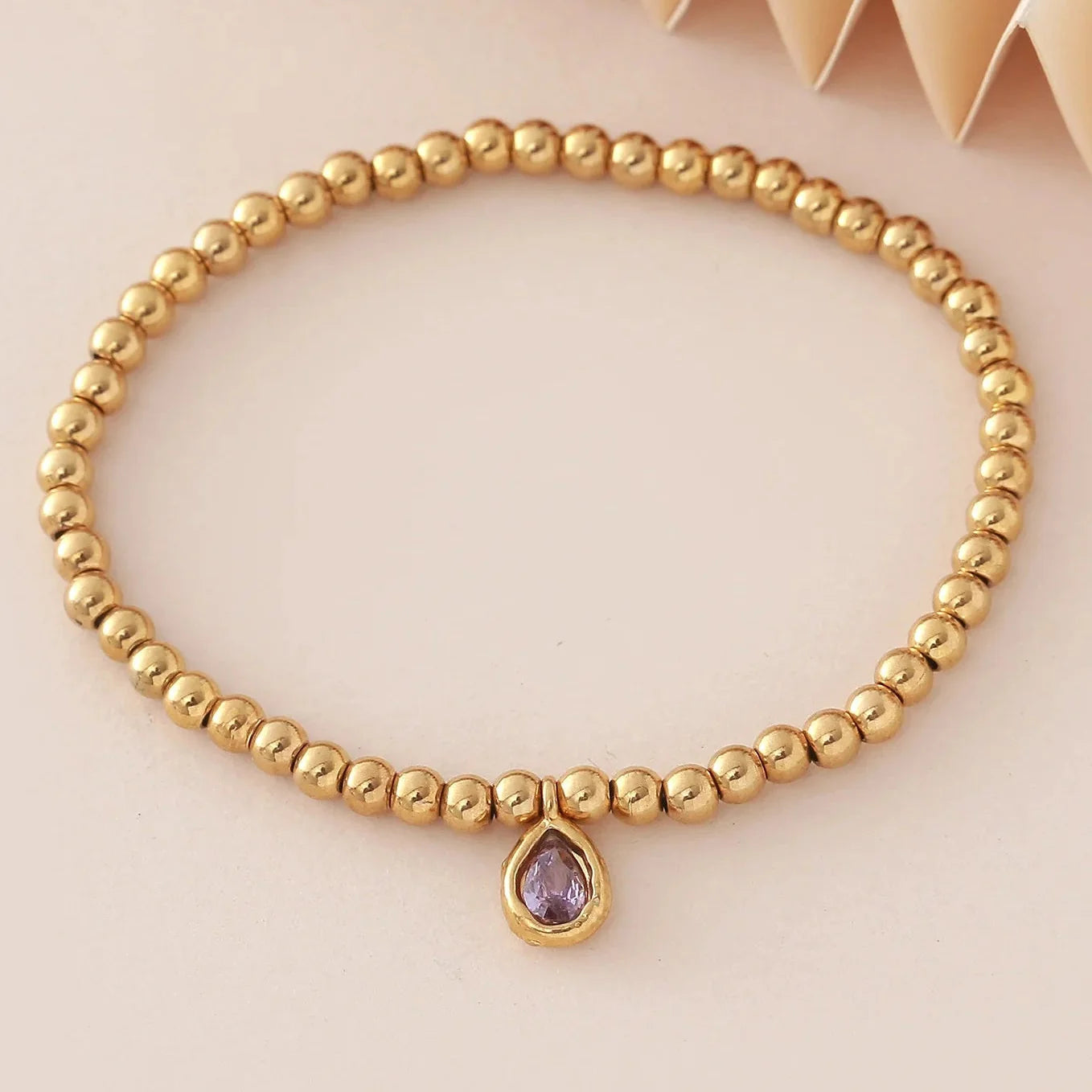 Bracelet doré avec pierre de naissance pour femme