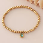 Bracelet doré avec pierre de naissance pour femme