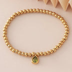 Bracelet doré avec pierre de naissance pour femme