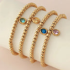 Bracelet doré avec pierre de naissance pour femme